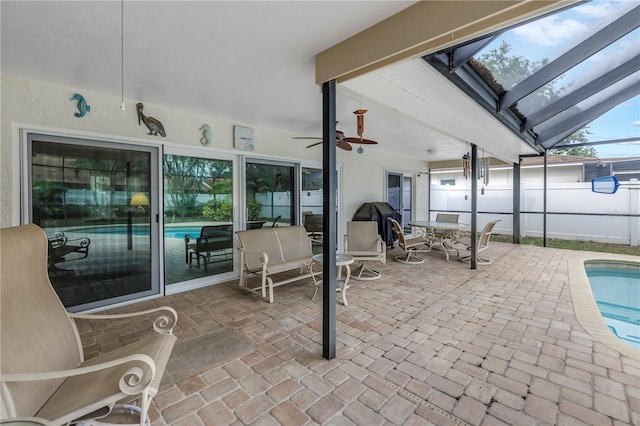 9674 104th Ave, Largo, FL 33773 - view of patio with a ceiling fan, glass enclosure, and outdoor dining area