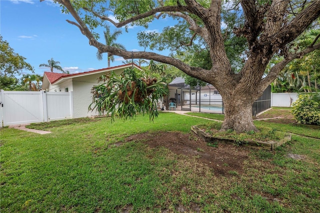 9674 104th Ave, Largo, FL 33773 - view of yard with a gate, a lanai, and a patio area