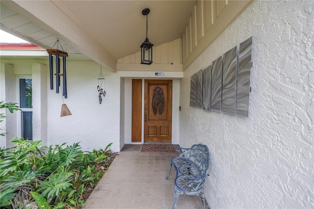 9674 104th Ave, Largo, FL 33773 - property entrance featuring stucco siding and a porch