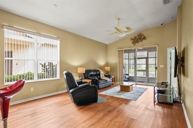 31108 Whitlock Dr, Wesley Chapel, FL 33543 - living area featuring wood finished floors, ceiling fan, lofted ceiling, and baseboards