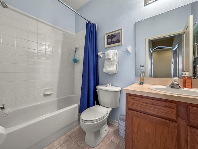 31108 Whitlock Dr, Wesley Chapel, FL 33543 - full bath with shower / tub combo, toilet, vanity, tile patterned flooring, and baseboards
