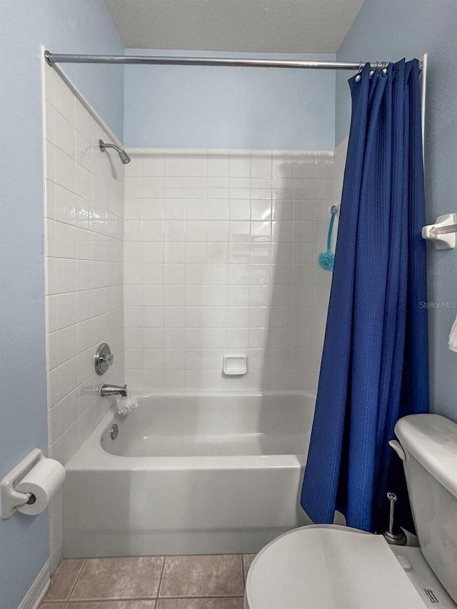 31108 Whitlock Dr, Wesley Chapel, FL 33543 - full bath featuring toilet, shower / bathtub combination with curtain, tile patterned floors, and baseboards