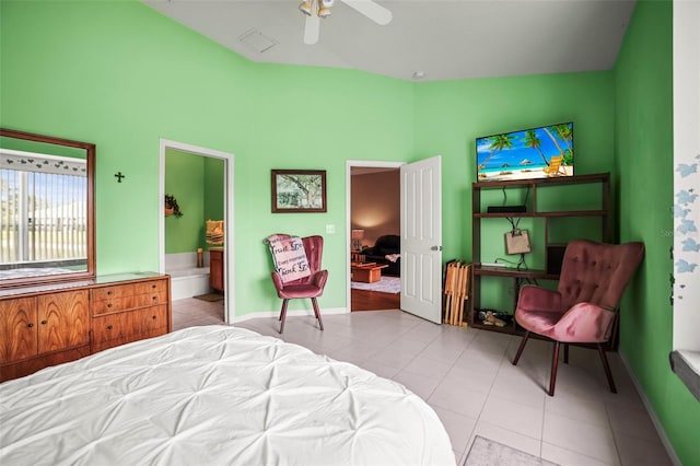 31108 Whitlock Dr, Wesley Chapel, FL 33543 - tiled bedroom featuring connected bathroom, baseboards, and a ceiling fan