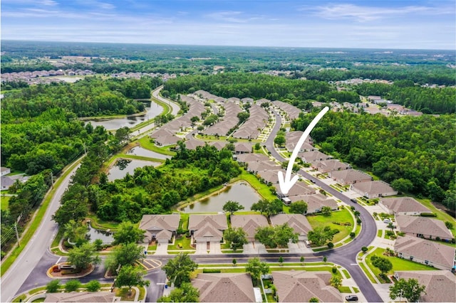 31108 Whitlock Dr, Wesley Chapel, FL 33543 - aerial perspective of suburban area with a nearby body of water