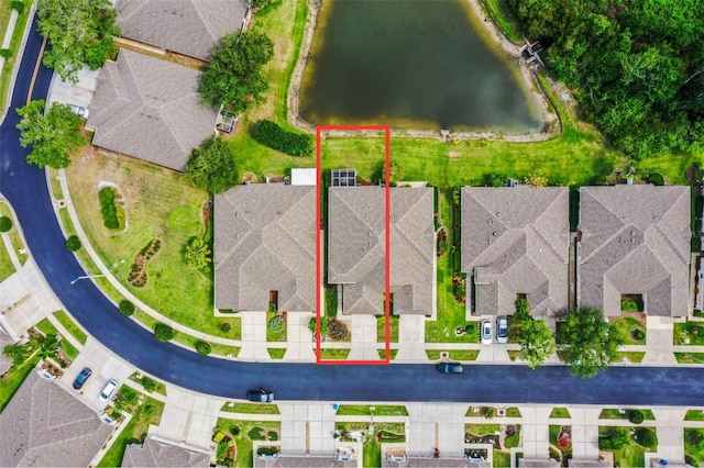 31108 Whitlock Dr, Wesley Chapel, FL 33543 - aerial perspective of suburban area with property boundaries highlighted and a large body of water