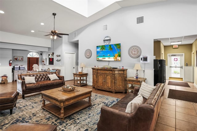 31108 Whitlock Dr, Wesley Chapel, FL 33543 - living room featuring tile patterned flooring, a ceiling fan, recessed lighting, high vaulted ceiling, and a wainscoted wall