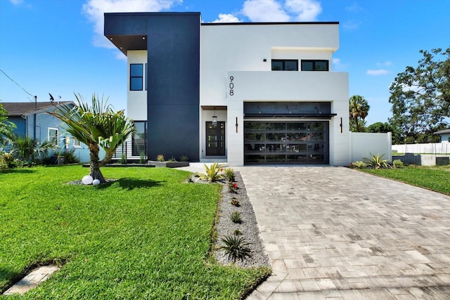 908 W Fribley St, Tampa, FL 33603 - modern home with decorative driveway and stucco siding