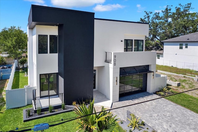908 W Fribley St, Tampa, FL 33603 - modern home with stucco siding and a balcony