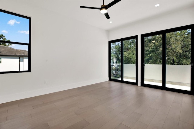 908 W Fribley St, Tampa, FL 33603 - unfurnished room with wood finished floors, ceiling fan, and recessed lighting