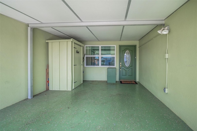 250 Rosery Rd NW Unit 218, Largo, FL 33770 - empty room with speckled floor