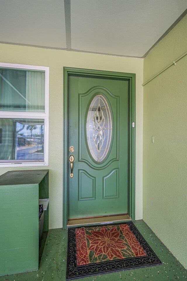 250 Rosery Rd NW Unit 218, Largo, FL 33770 - view of exterior entry featuring stucco siding