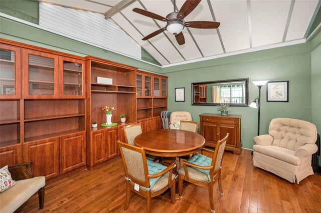 250 Rosery Rd NW Unit 218, Largo, FL 33770 - dining room with vaulted ceiling, a ceiling fan, and light wood-style flooring