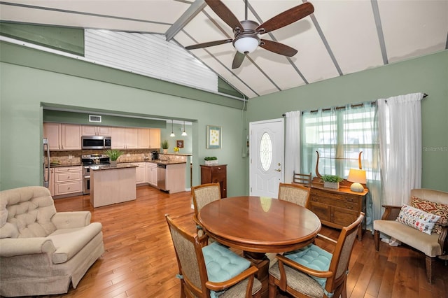 250 Rosery Rd NW Unit 218, Largo, FL 33770 - dining space featuring lofted ceiling, a ceiling fan, and light wood-style floors