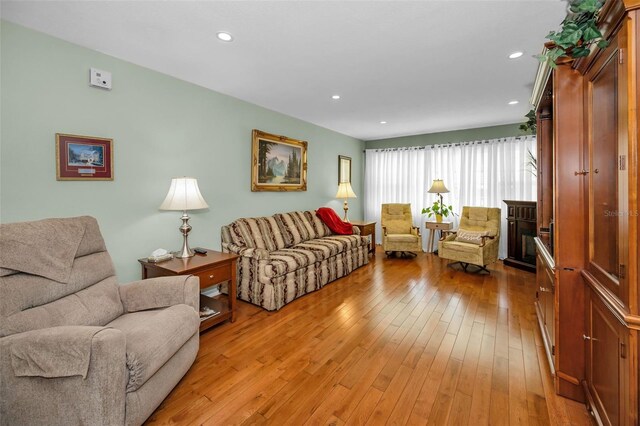 250 Rosery Rd NW Unit 218, Largo, FL 33770 - living area with light wood finished floors and recessed lighting