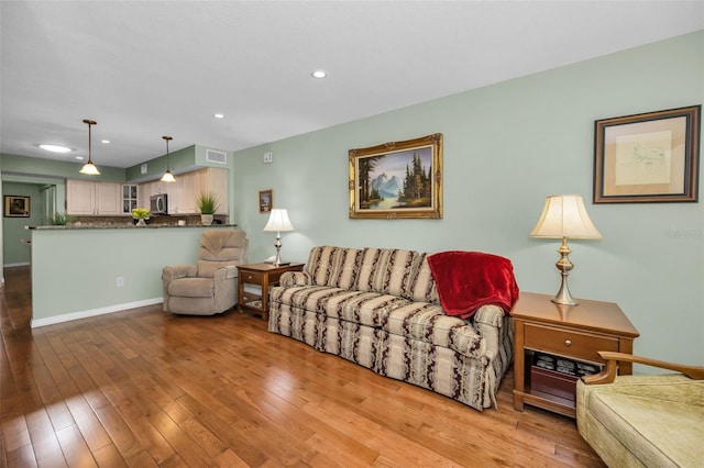 250 Rosery Rd NW Unit 218, Largo, FL 33770 - living area featuring recessed lighting and hardwood / wood-style flooring