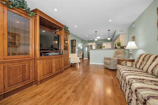 250 Rosery Rd NW Unit 218, Largo, FL 33770 - living room with light wood-type flooring and recessed lighting