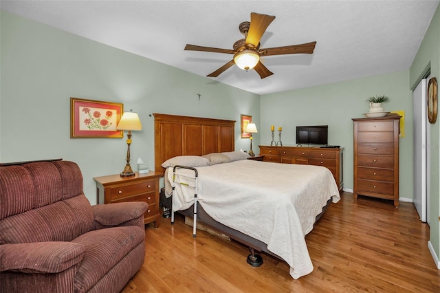 250 Rosery Rd NW Unit 218, Largo, FL 33770 - bedroom with wood finished floors and a ceiling fan