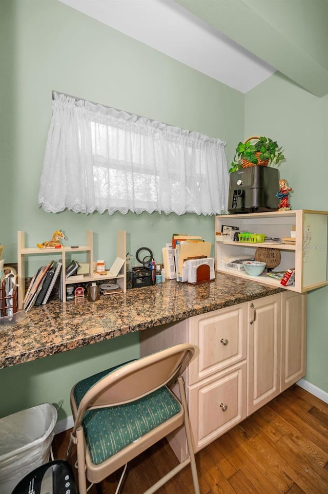 250 Rosery Rd NW Unit 218, Largo, FL 33770 - kitchen featuring wood finished floors and dark stone counters