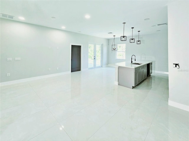 3115 52nd St W, Lehigh Acres, FL 33971 - kitchen featuring a sink, open floor plan, baseboards, recessed lighting, and light countertops