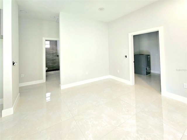 3115 52nd St W, Lehigh Acres, FL 33971 - empty room with baseboards and light tile patterned floors