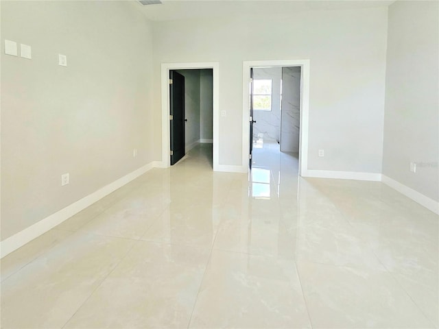 3115 52nd St W, Lehigh Acres, FL 33971 - spare room with baseboards and light tile patterned floors