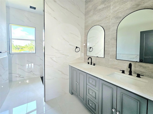 3115 52nd St W, Lehigh Acres, FL 33971 - bathroom with tile walls and double vanity