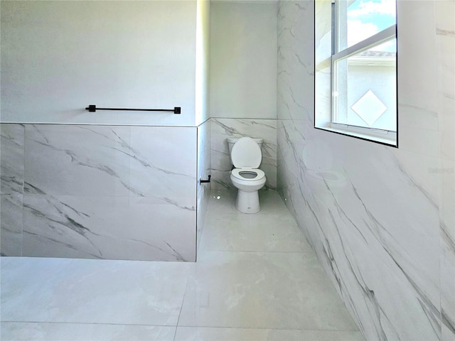 3115 52nd St W, Lehigh Acres, FL 33971 - bathroom with toilet and tile walls