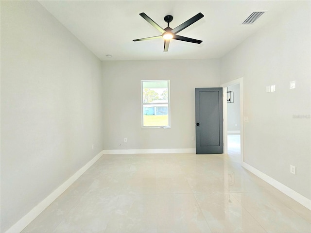 3115 52nd St W, Lehigh Acres, FL 33971 - spare room featuring ceiling fan, baseboards, and light tile patterned floors