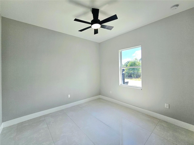 3115 52nd St W, Lehigh Acres, FL 33971 - unfurnished room featuring baseboards, a ceiling fan, and light tile patterned flooring