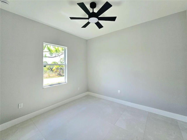 3115 52nd St W, Lehigh Acres, FL 33971 - unfurnished room featuring baseboards, a ceiling fan, and light tile patterned flooring