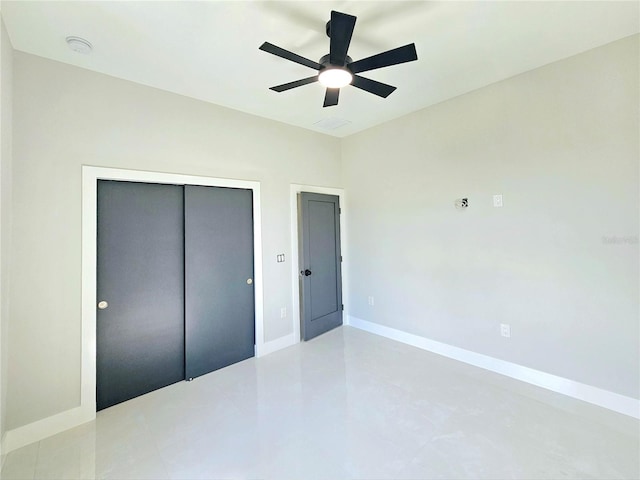 3115 52nd St W, Lehigh Acres, FL 33971 - unfurnished bedroom featuring a closet, baseboards, and ceiling fan