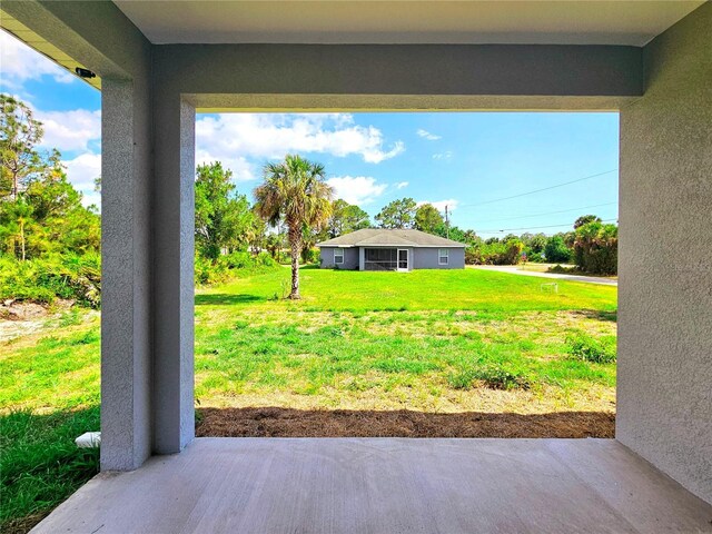3115 52nd St W, Lehigh Acres, FL 33971 - view of grassy yard featuring a patio area
