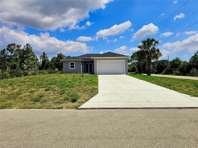 3115 52nd St W, Lehigh Acres, FL 33971 - view of front of property with a front yard, concrete driveway, a garage, and stucco siding