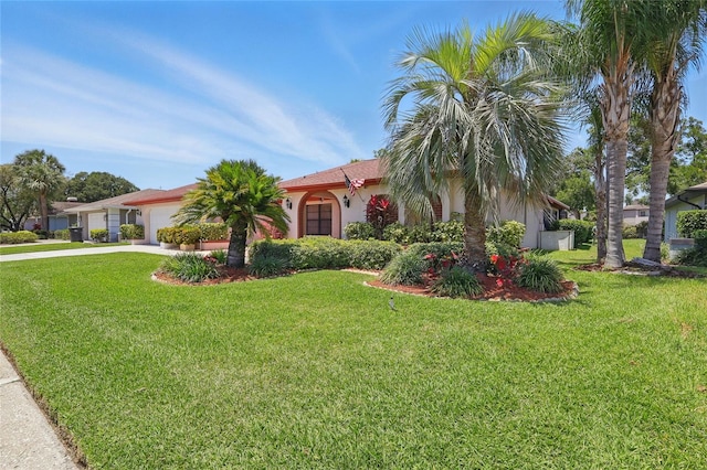 14168 Fennsbury Dr, Tampa, FL 33624 - view of front of home with a garage, concrete driveway, and a front yard