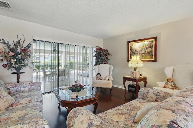 14168 Fennsbury Dr, Tampa, FL 33624 - living room with wood finished floors, a textured ceiling, and baseboards