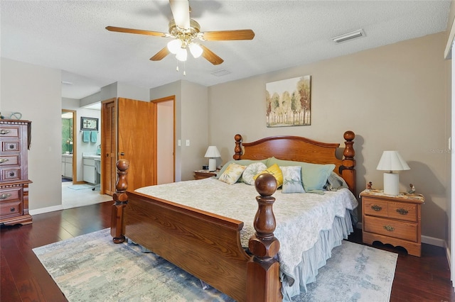 14168 Fennsbury Dr, Tampa, FL 33624 - bedroom with wood finished floors, a textured ceiling, ensuite bath, baseboards, and ceiling fan