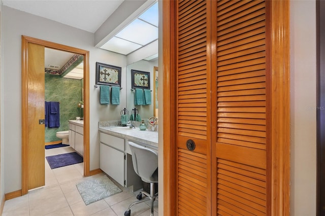 14168 Fennsbury Dr, Tampa, FL 33624 - full bath featuring a closet, vanity, tile patterned flooring, and toilet