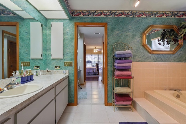 14168 Fennsbury Dr, Tampa, FL 33624 - full bathroom with tile patterned floors, ensuite bath, vanity, a bath, and baseboards