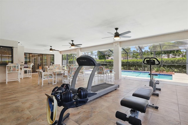 14168 Fennsbury Dr, Tampa, FL 33624 - exercise room with a sunroom, tile patterned flooring, and a ceiling fan