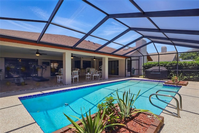 14168 Fennsbury Dr, Tampa, FL 33624 - outdoor pool featuring a patio area, a jacuzzi, ceiling fan, and glass enclosure