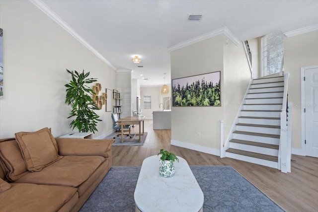 230 Columbia Dr, Tampa, FL 33606 - living area with wood finished floors, ornamental molding, baseboards, and stairs