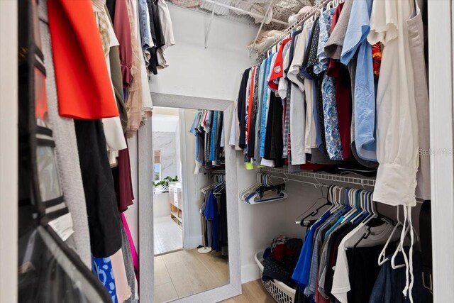 230 Columbia Dr, Tampa, FL 33606 - walk in closet with wood finished floors