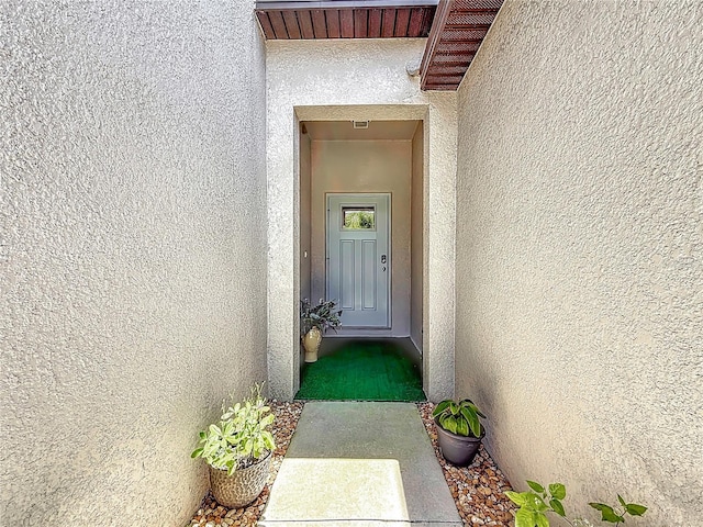 841 Royal Empress Dr, Ruskin, FL 33570 - view of exterior entry featuring stucco siding