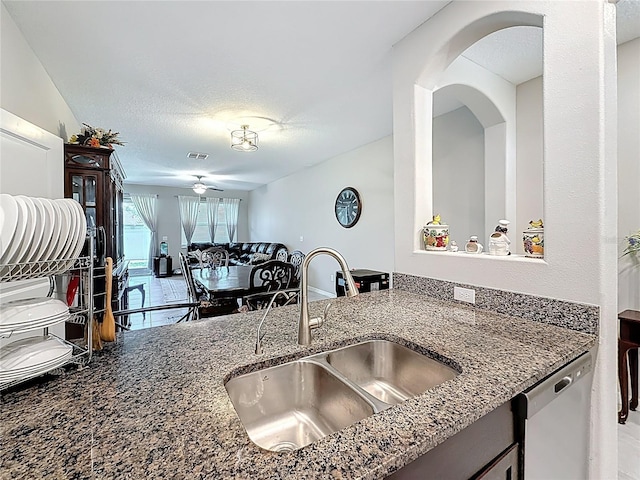 841 Royal Empress Dr, Ruskin, FL 33570 - kitchen featuring dishwasher, a sink, dark stone counters, and ceiling fan