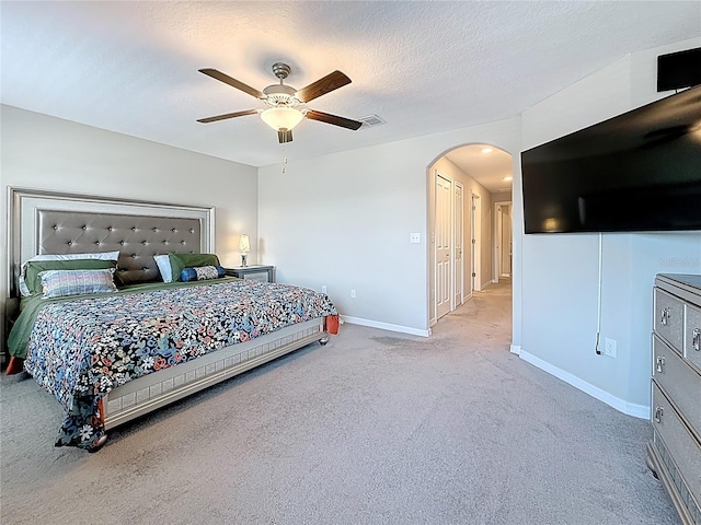 841 Royal Empress Dr, Ruskin, FL 33570 - bedroom featuring arched walkways, carpet, baseboards, and ceiling fan
