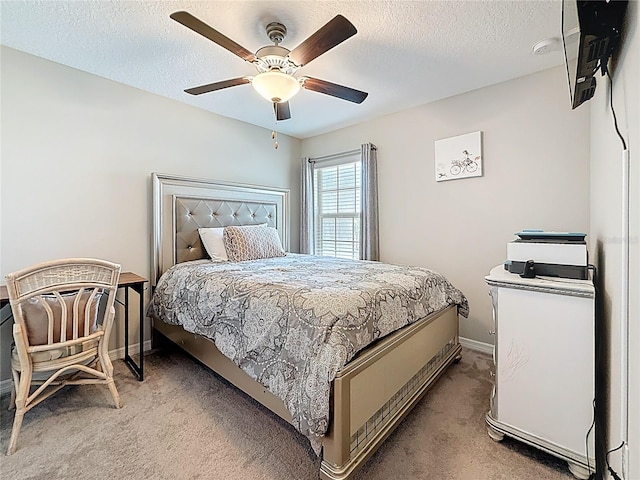 841 Royal Empress Dr, Ruskin, FL 33570 - bedroom with light carpet, baseboards, a textured ceiling, and a ceiling fan