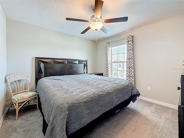 841 Royal Empress Dr, Ruskin, FL 33570 - carpeted bedroom with baseboards, a textured ceiling, and a ceiling fan
