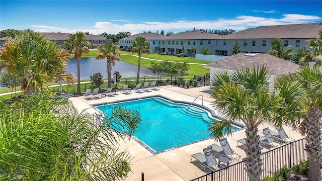 841 Royal Empress Dr, Ruskin, FL 33570 - community pool with a water view, a patio, and a residential view