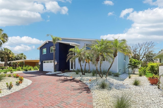 931 Gulf Blvd, Belleair Beach, FL 33786 - view of front of home featuring an attached garage and decorative driveway