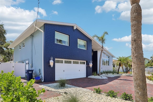 931 Gulf Blvd, Belleair Beach, FL 33786 - view of front of home featuring a garage and decorative driveway